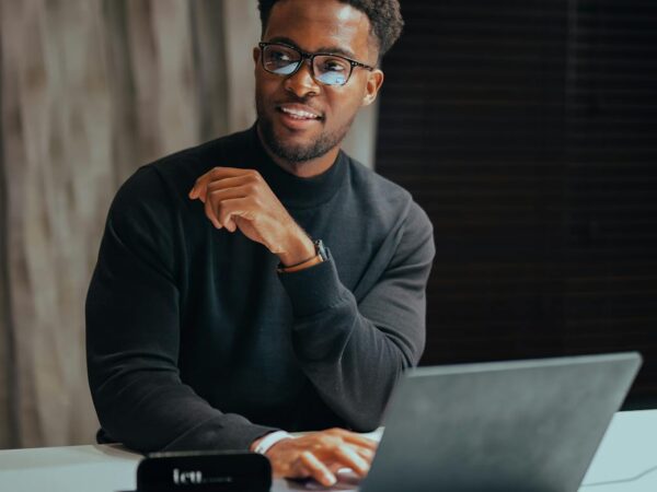 man in eyeglasses with laptop