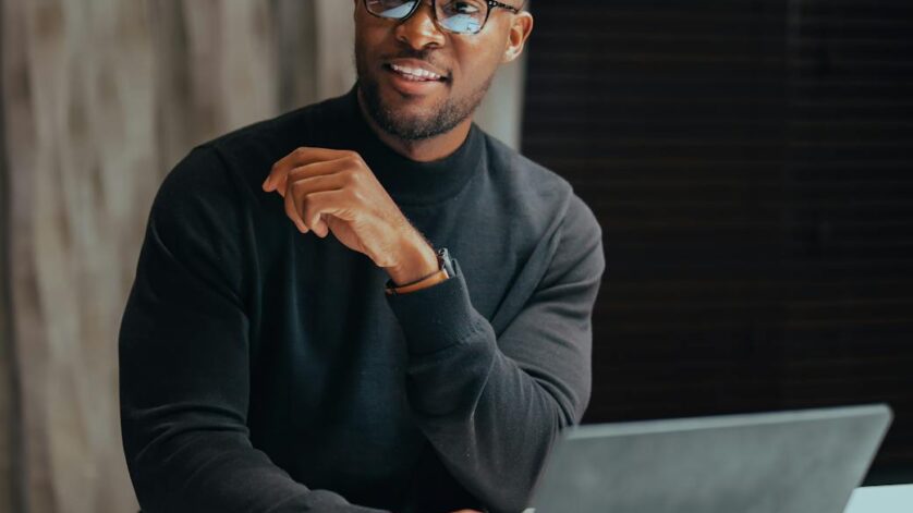 man in eyeglasses with laptop