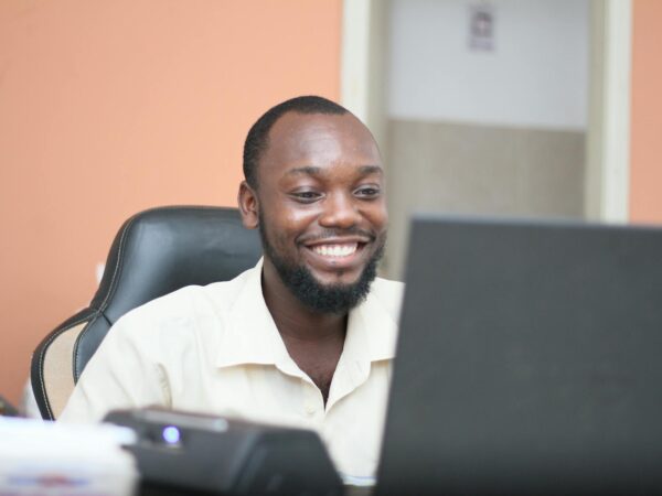 man in white dress shirt smiling