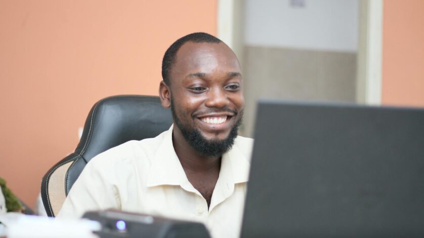 man in white dress shirt smiling