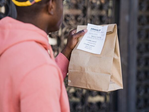 man with bag and smartphone