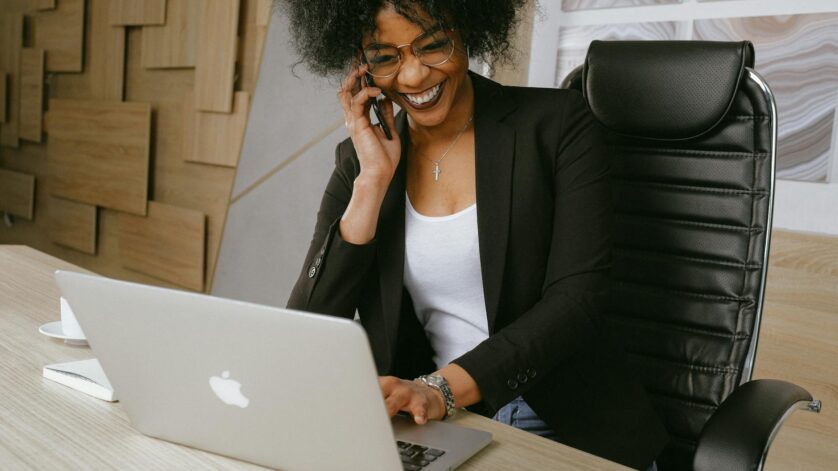 woman in black blazer sitting on black office chair