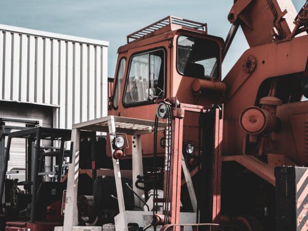 forklift and crane in an industrial area