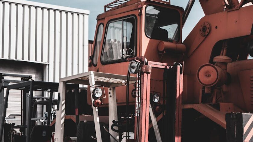 forklift and crane in an industrial area