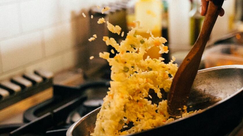 cooking fried rice in frying pan