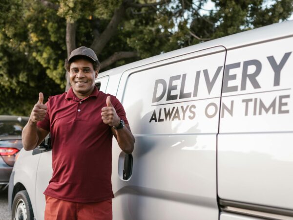 a deliveryman with his thumbs up