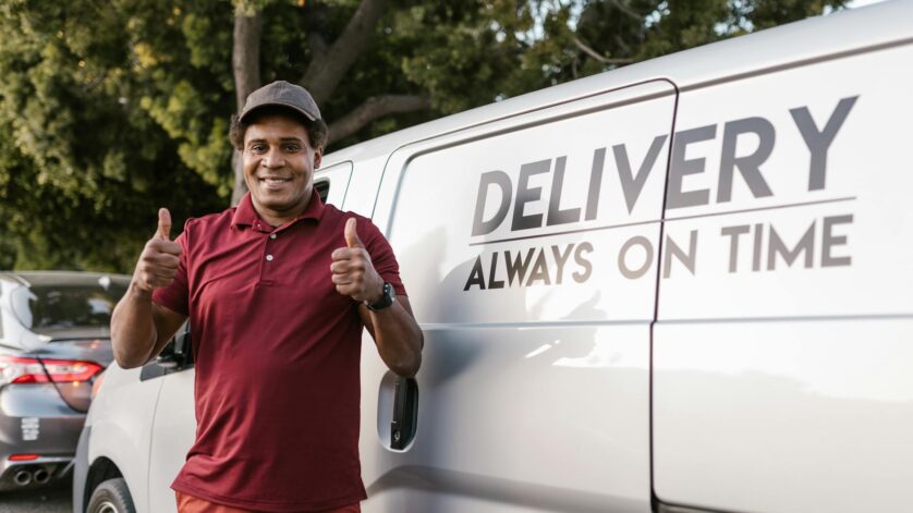 a deliveryman with his thumbs up