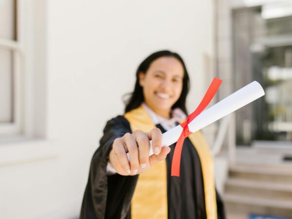 a woman holding a diploma