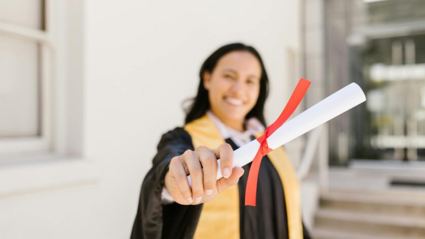 a woman holding a diploma