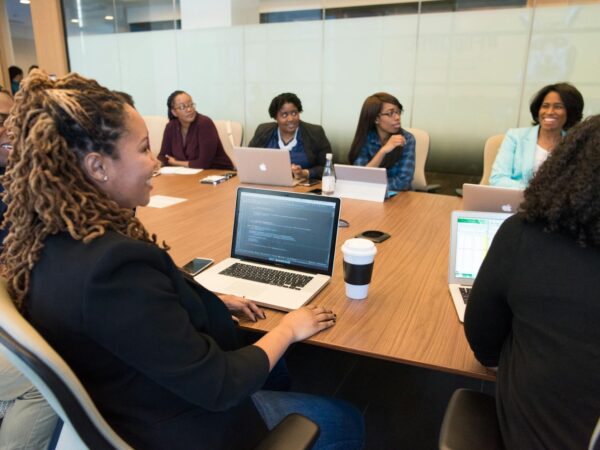 group of people using laptop computer