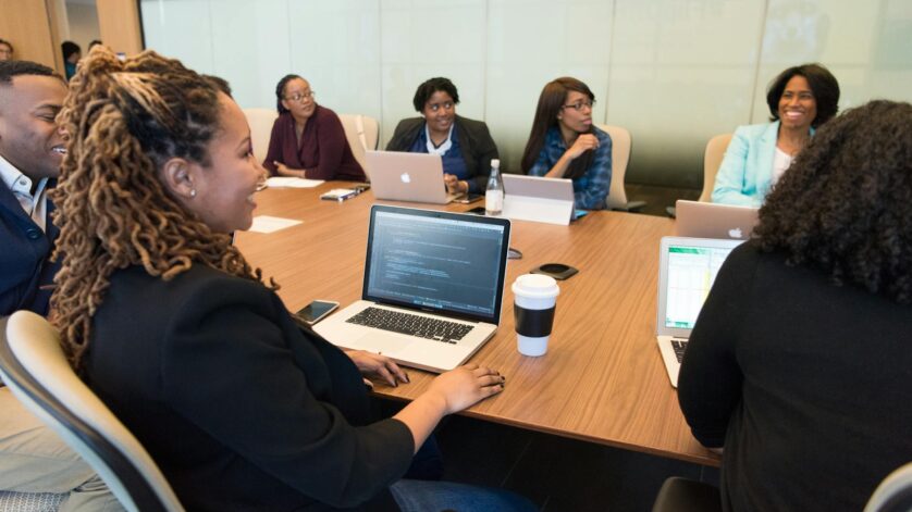 group of people using laptop computer