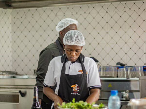 chefs preparing dishes in a kenyan kitchen