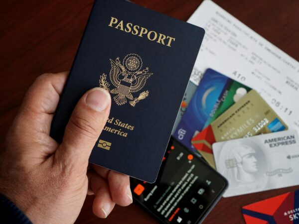 close up of us passport with travel essentials