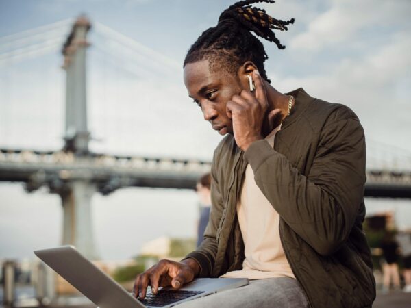 serious black man working on project on laptop