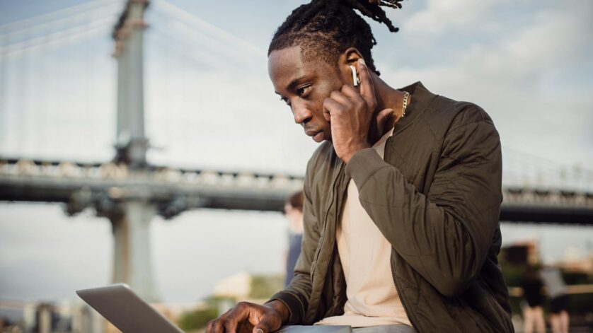 serious black man working on project on laptop