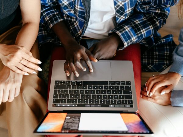 diverse women chatting online on laptop