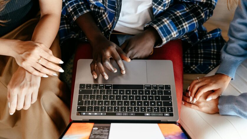 diverse women chatting online on laptop