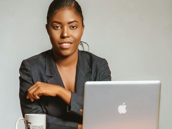 close up shot of a woman in black blazer looking at camera