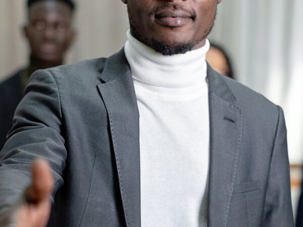 a man in a suit and a turtleneck