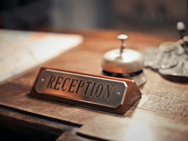 selective focus photo of reception signage