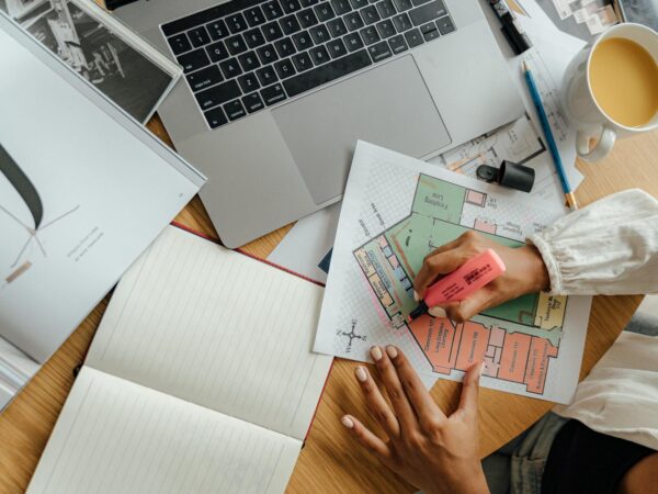 person holding white printer paper