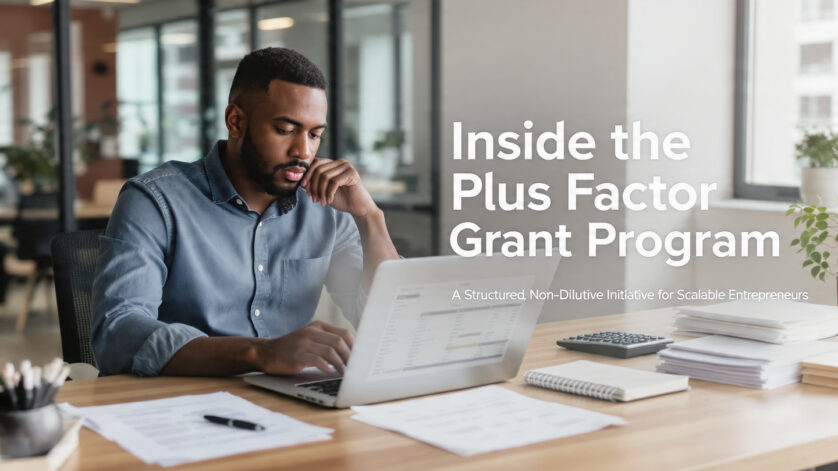Entrepreneur reviewing structured grant documents inside a professional incubation hub workspace